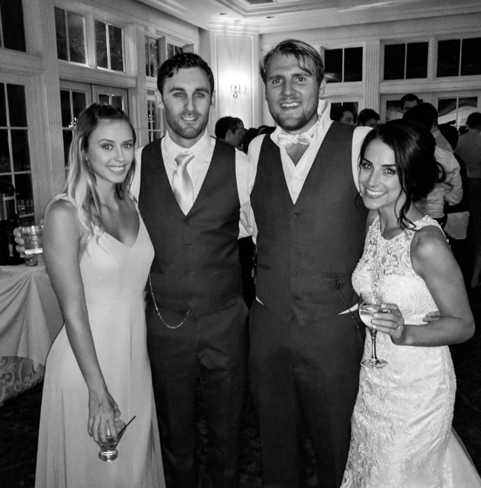 Garrett Gillin standing with friends at his best friend's wedding
